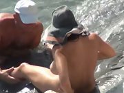 Mature duo fooling around in the surf giving each other oral fuck-fest